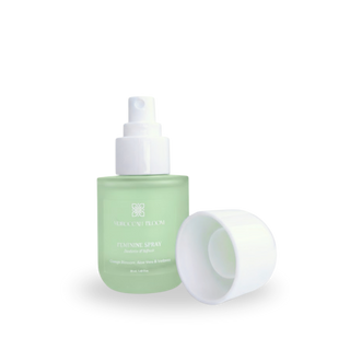 Open bottle of Moroccan Bloom Feminine Spray showing the white spray pump nozzle and cap, highlighting the easy-to-use intimate mist applicator.