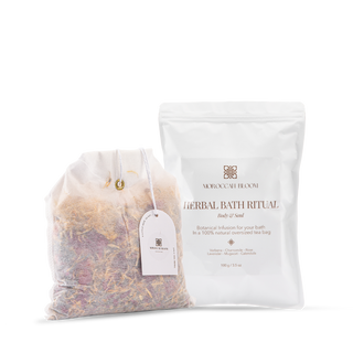 Moroccan Bloom Herbal Bath Ritual set showing the white outer packaging and the oversized tea bag filled with dried lavender, rose, and calendula botanical infusion.
